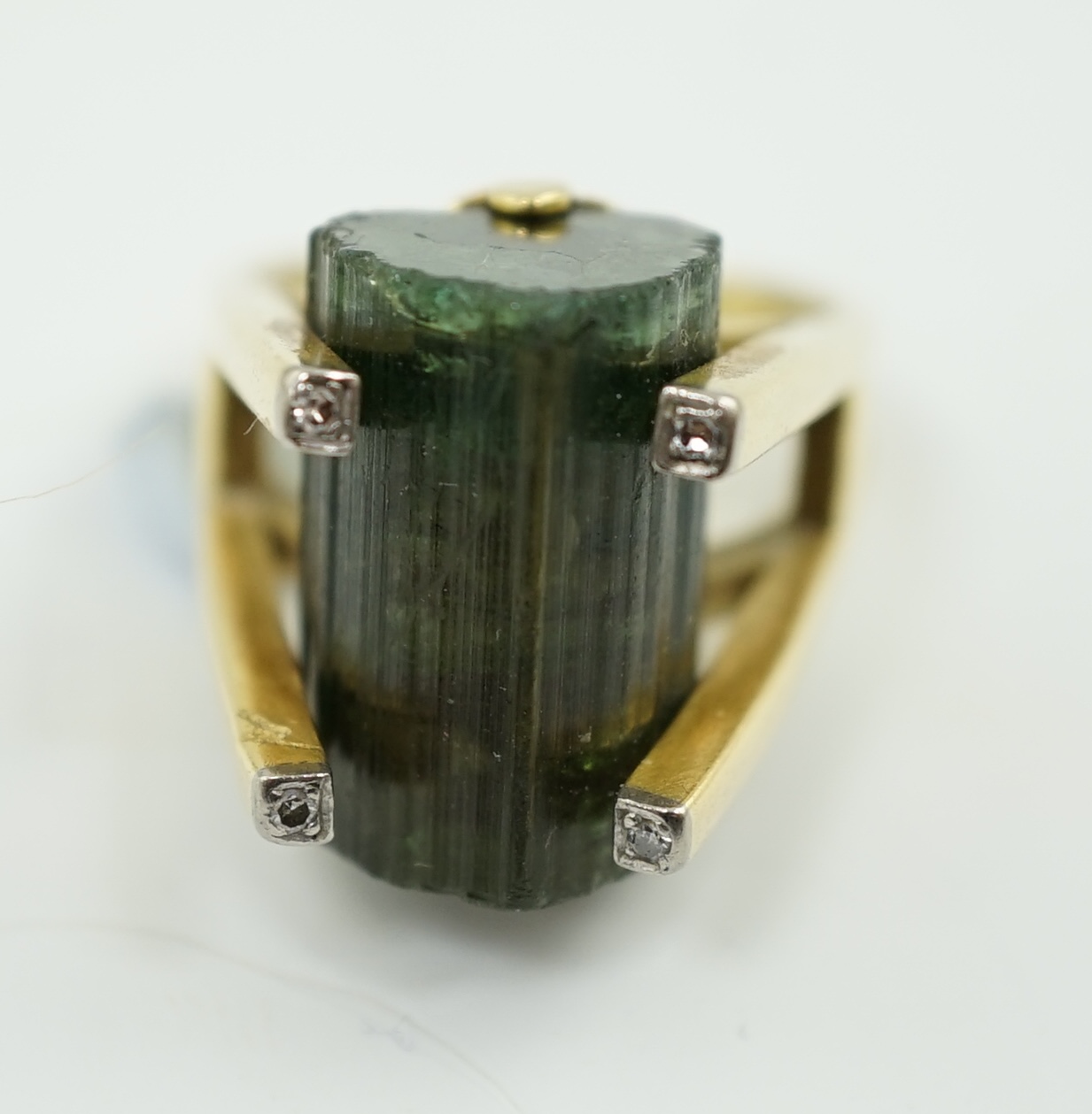 An early 1970's 18ct gold, raw cut watermelon tourmaline? and four stone diamond chip set dress ring